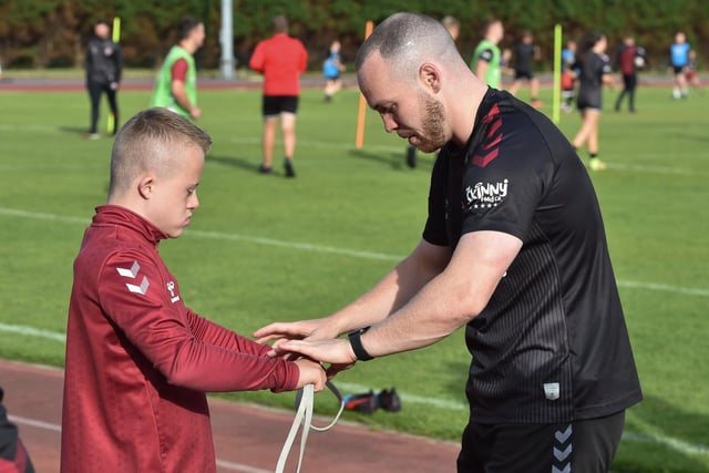 Liam Marshall chats with another player at the club.