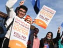 Flags and placards were waved by junior doctors on the picket line outside Wigan Infirmary earlier this year