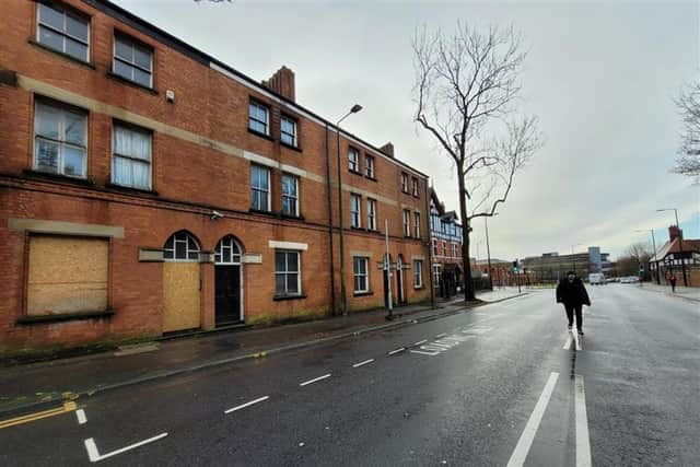 The three Victorian townhouses are in New Market Street, Wigan