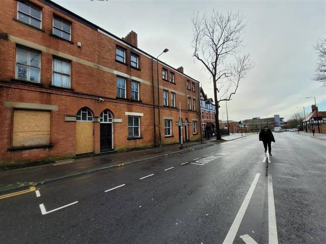 The three Victorian townhouses are in New Market Street, Wigan