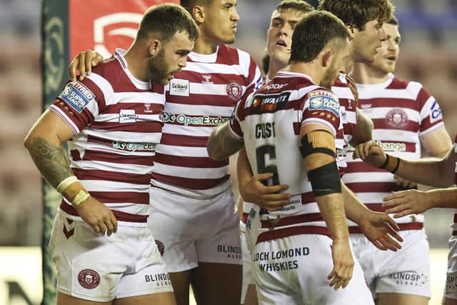 Wigan Warriors produced a victory over Catalans Dragons on Friday night
