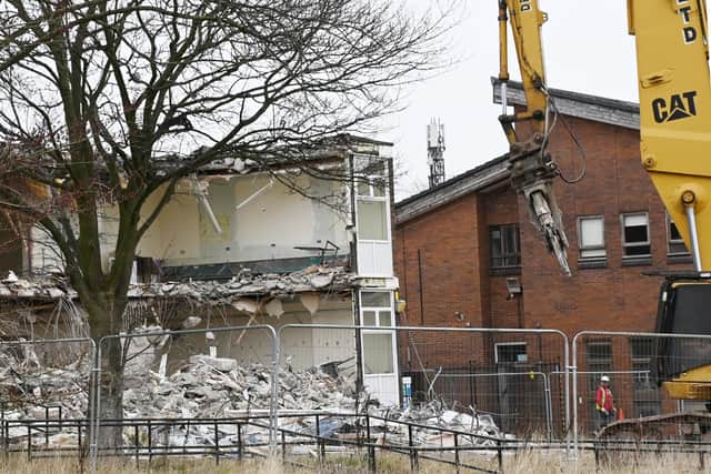 Old classrooms come tumbling down