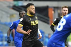 Jordan Cousins in action for Latics at Cardiff last term