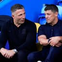Warrington Wolves coach Sam Burgess (left) and Wigan Warriors boss Matt Peet (right) in conversation
