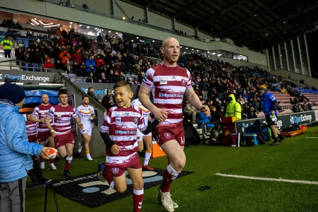 Liam Farrell leads out Wigan Warriors