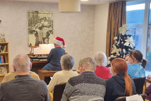 Denis performed for fellow residents and staff at the home.