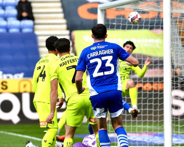James Carragher nods home a planned corner routine against Rotherham on Monday