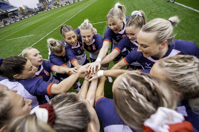 England huddle prior to play against Wales.