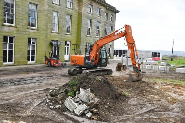 A fence is being put up so work can begin on the exterior of Haigh Hall and could be up for two years.