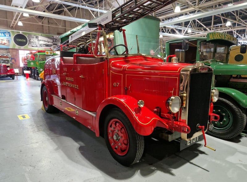 A gorgeous red fire engine from many moons ago