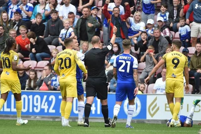 Ched Evans is sent off against Latics on the opening day of the campaign