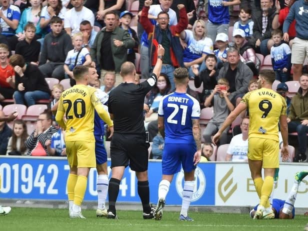 Ched Evans is sent off against Latics on the opening day of the campaign