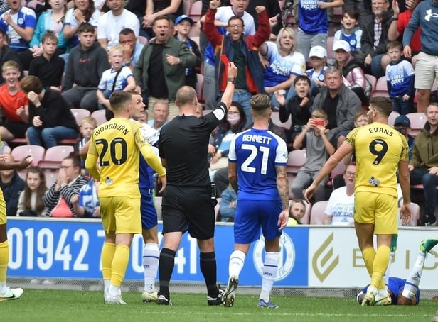 Ched Evans is sent off against Latics on the opening day of the campaign