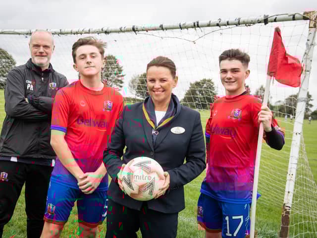 From L to R Coach Peter Roberts with players Nathan Heron and James Metcalfe plus Bellway's sales advisor Leanda
