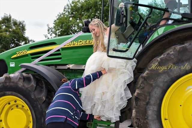 Michaela Dawber arrives at her Shevington High School prom on a tractor