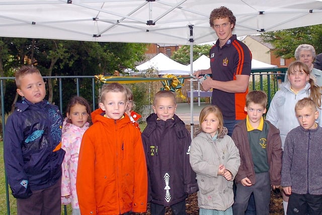 2008  - Wigan Warriors  Sean O' Loughlin cuts the ribbon to open St Patricks  School garden, funded by One Voice and RBS.
