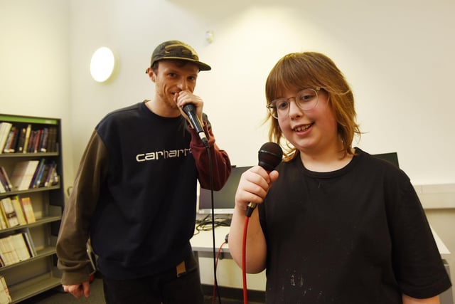 Beatboxer Chris Maylor, known as Renegrade, with nine-year-old Hector Yates