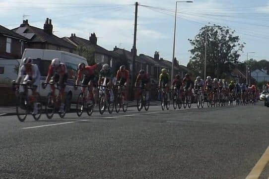 The Tour of Britain flies along Atherton Road, Hindley in 2019