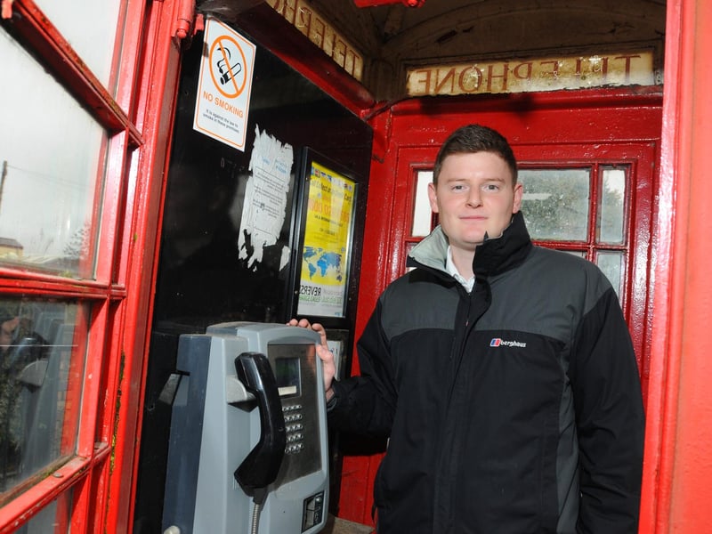 Coun Nathan Murray was encouraging residents to take part in a BT consultation as it planned to remove four phone boxes in the area because they weren't being used. He is pictured at the phone box outside The Park Hotel pub, Wigan Road, Ashton-in-Makerfield