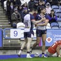 England's Matty Ashton (c) celebrates scoring his second try against Tonga.