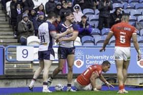 England's Matty Ashton (c) celebrates scoring his second try against Tonga.