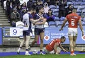 England's Matty Ashton (c) celebrates scoring his second try against Tonga.