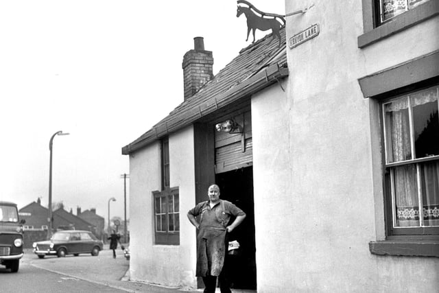 The last remaining blacksmith's forge in south west Lancashire on Kenyon Lane, Lowton, just before closure in 1968. The blacksmith is possibly Herbert Jordan.