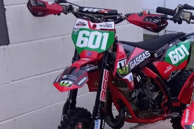 Bailey Mitchell's MX bike which was stoeln by thieves. It has the number, "602", which was his uncle Billy's date of birth.