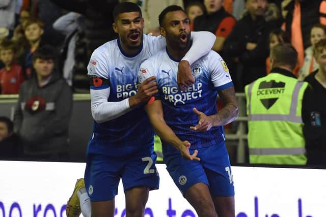 Curtis Tilt is congratulated after his winning goal against Blackpool by Ashley Fletcher