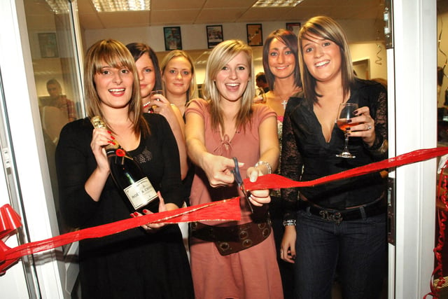 Hollyoaks star, Carley Stenson, who played Steph Dean in the soap cuts the ribbon to officially open the new Laura Leanne & Co hair salon in Shevington with owner, Laura Crompton, left, and her sister and top stylist Natalie, right, on Thursday 28th of September 2006.