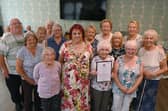 The Mayor of Wigan Coun Debbie Parkinson, centre, attends Kildare Grange, Hindley,  as volunteers at the social and dancing club who have been awarded the King's Award for Voluntary Service
