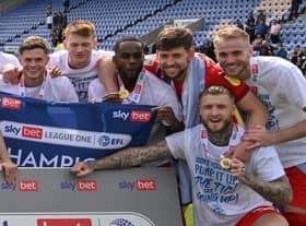 Gavin Massey in the centre of the title celebrations at Shrewsbury