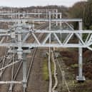 New overhead line stanchions and cables on the Wigan to Bolton route