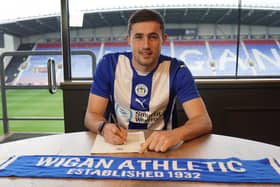 James Carragher has extended his stay with Latics until at least the summer of 2027