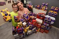 Charlie Heslin, age 10, and his mum, Tracy Heslin, pictured with the Easter eggs for donation.
