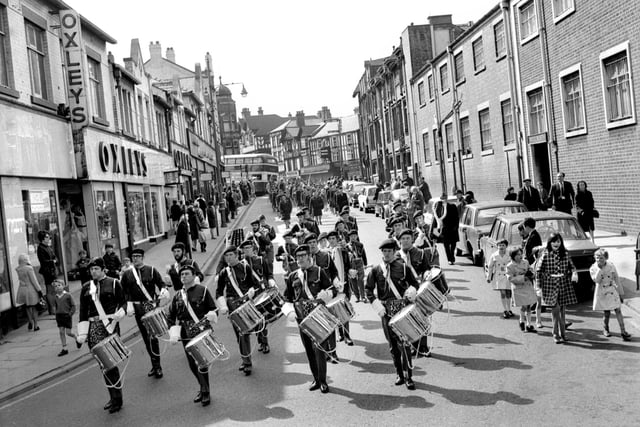The St. George's Day parade makes its way down Station Road, Wigan, in 1970.