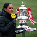 The BBC's Alex Scott with the FA Cup trophy