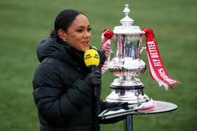 The BBC's Alex Scott with the FA Cup trophy