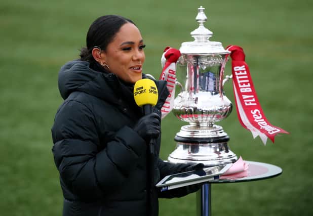 The BBC's Alex Scott with the FA Cup trophy