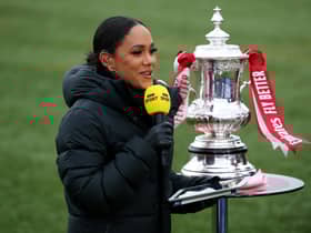 The BBC's Alex Scott with the FA Cup trophy