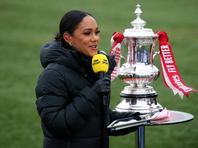 The BBC's Alex Scott with the FA Cup trophy