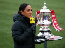 The BBC's Alex Scott with the FA Cup trophy