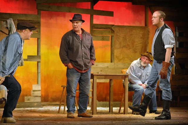 Jon Dawson, as Lennie, John Churnside, as George, Peter O'Leary, as Candy, and Niall Wilkinson, as Curley, in Wigan Little Theatre's Of Mice And Men