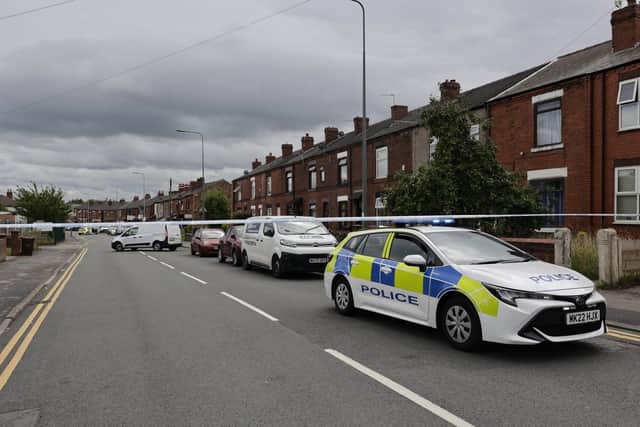 Downall Green Road was still cordoned off 12 hours after the shooting