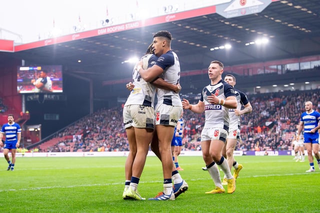 Kai Pearce-Paul celebrates with Dom Young, who went over for four first half tries against Greece in Sheffield.