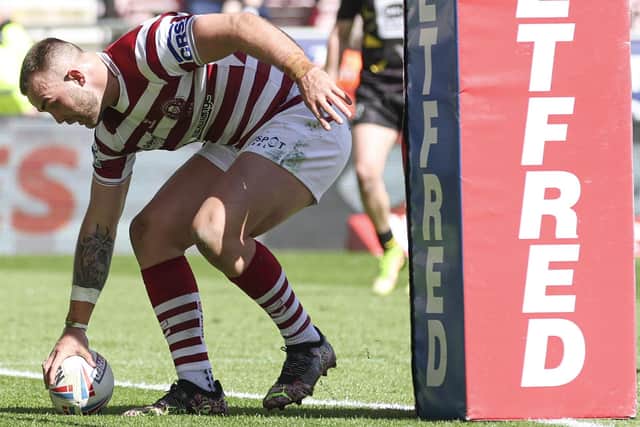 Kaide Ellis went over for his first try in cherry and white