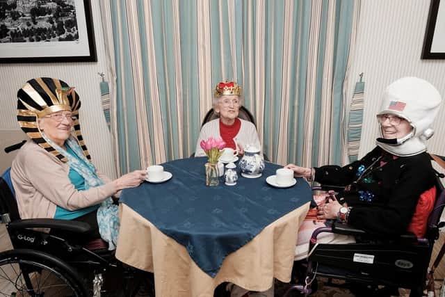 Residents Violet Huddard, June Hope and Sylvia Heys enjoying their history themed afternoon tea together