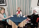 Residents Violet Huddard, June Hope and Sylvia Heys enjoying their history themed afternoon tea together