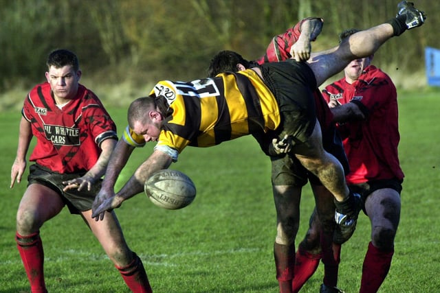 Former St. Helens forward, Paul Forber, playing for Haydock, is sent flying by Rose Bridge in a North West Counties Division One match on Saturday 19th of January 2002. Rose Bridge won 40-0.
