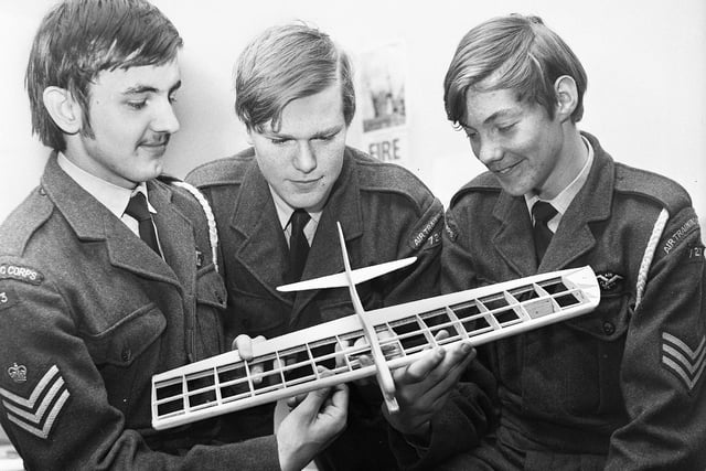 Studying a Gazelle stunt and combat model aircraft are, left to right, Flight Sgt. Phil Marsden, Leading cadet Stuart Bowen and Sgt. John Kay of the Wigan Air Training Corps squadron on Friday 24th of November 1972.